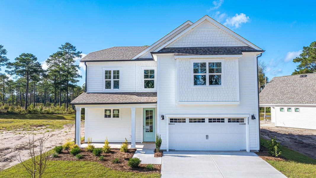 Front exterior of a new home in Rolling Hills, Bolivia, NC, highlighting curb appeal (Image 1).