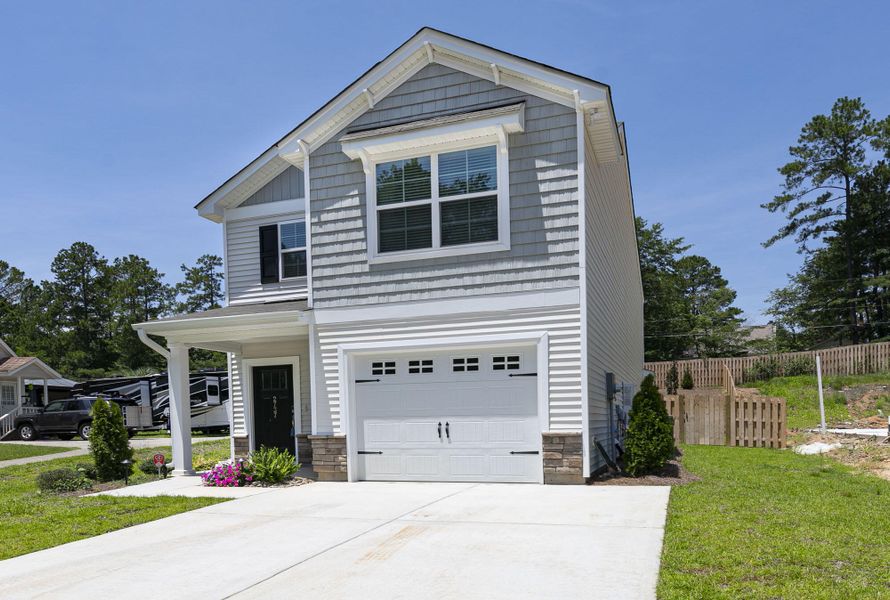 Front exterior of a new home in , Goose Creek, SC, highlighting curb appeal (Image 1).