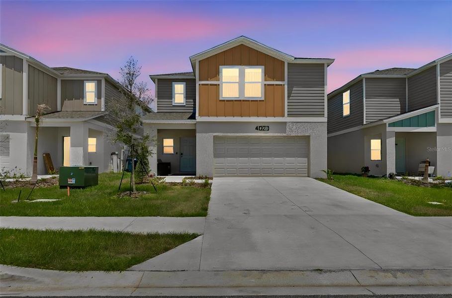 Front exterior of a new home in , Haines City, FL, highlighting curb appeal (Image 25).
