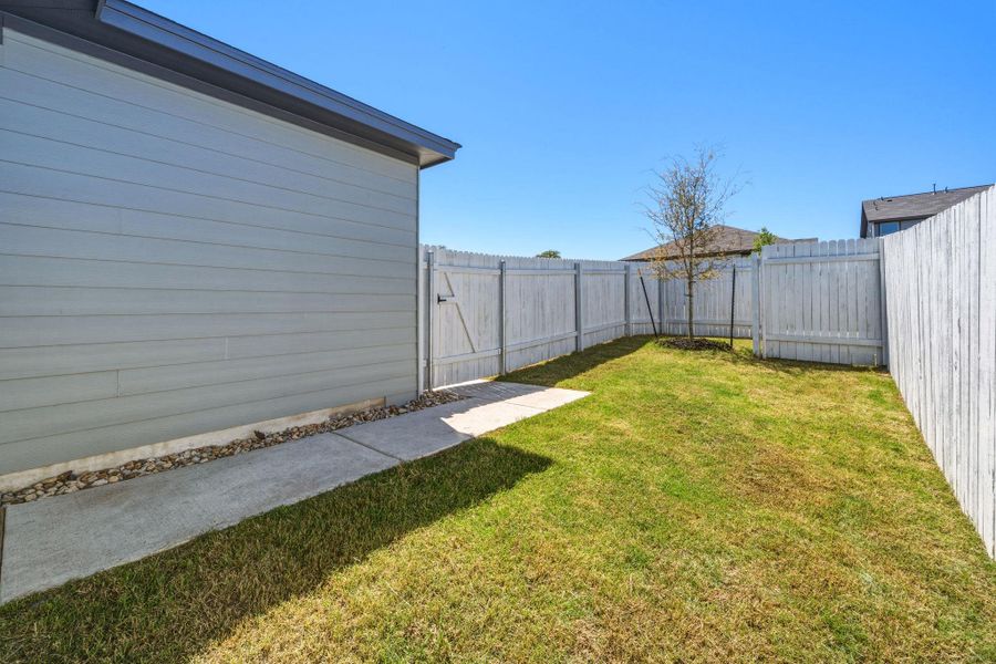 View of fenced backyard
