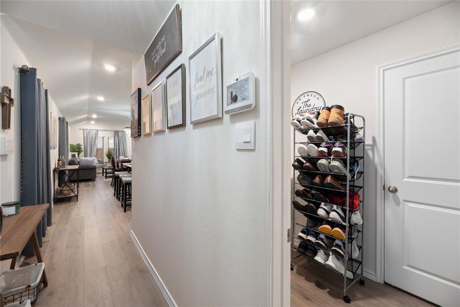 Hall featuring light wood-style flooring and recessed lighting