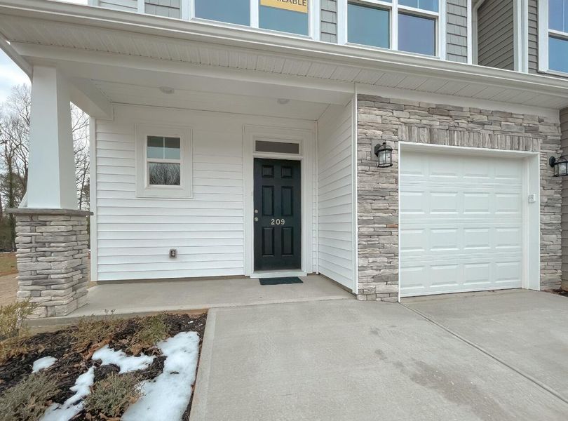 Exterior details and patio area of a home in East Main Townes, Spartanburg (Image 2). Exterior details and patio area of a home in East Main Townes, Spartanburg (Image 2).