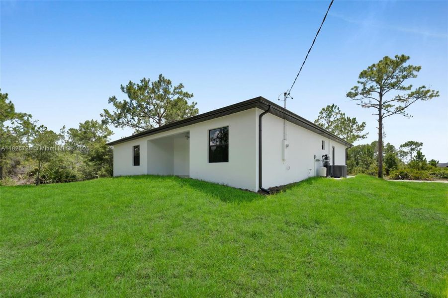 Exterior details and patio area of a home in , Lehigh Acres (Image 3).