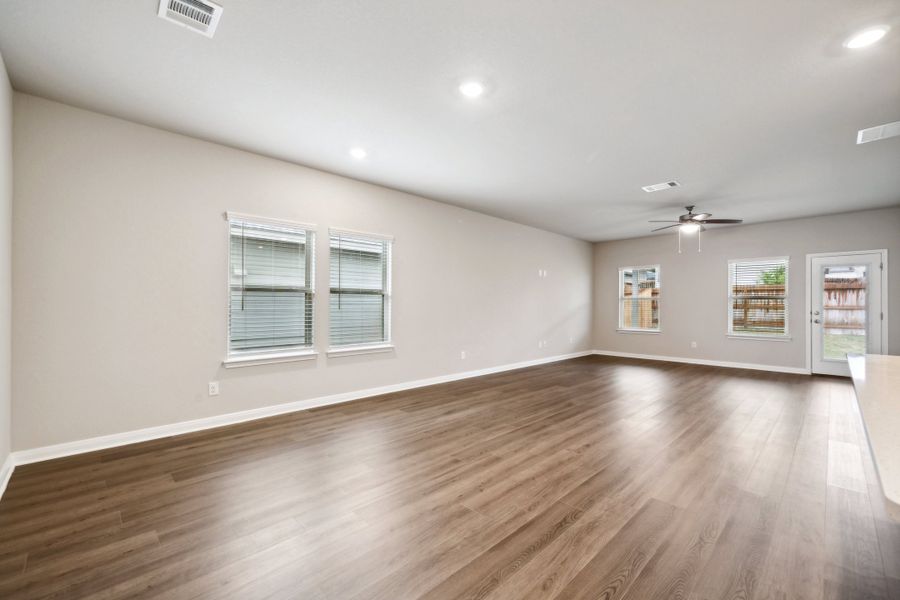 Dining room and living room in the Reynolds floorplan at a Meritage Homes community.