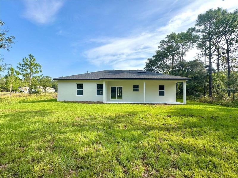 Exterior details and patio area of a home in , Citrus Springs (Image 17).