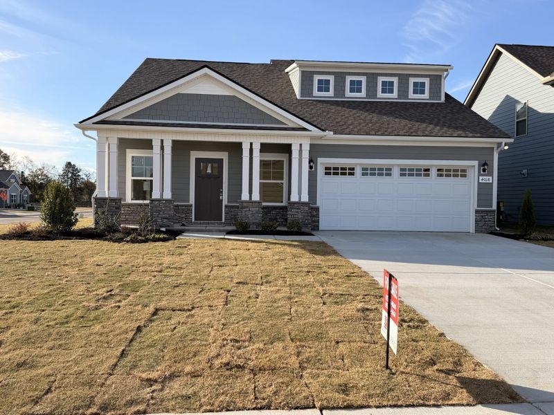 Stunning new home with 3 bedrooms + a spacious bonus room sitting on a prominent corner lot with standout curb appeal!