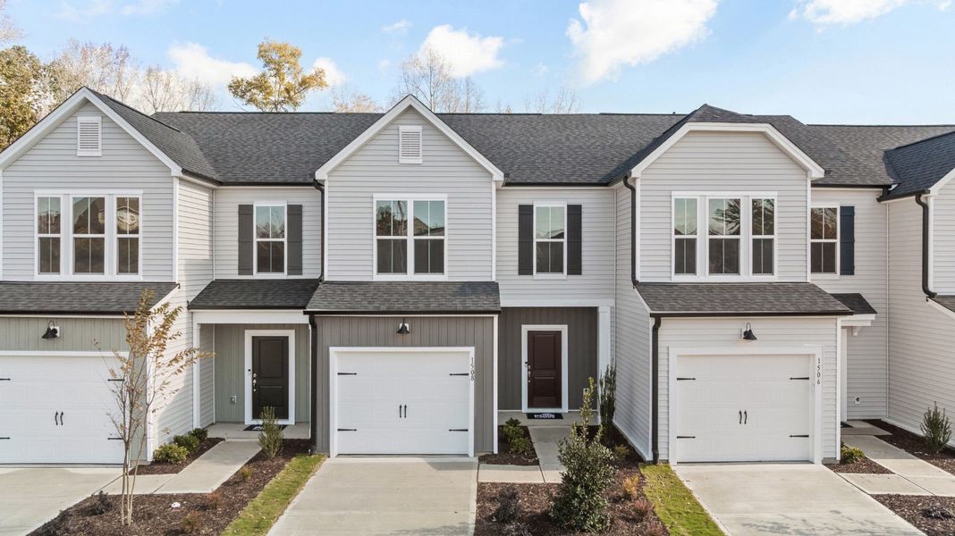 Front exterior of a new home in Flemingfield, Greensboro, NC, highlighting curb appeal (Image 1).