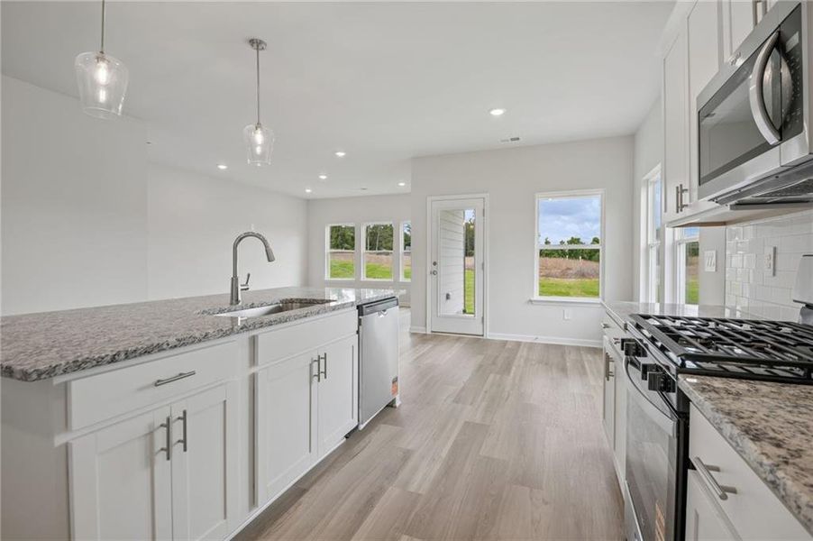 Furnished interior view inside a new home in Northwoods at Mirror Lake, Villa Rica (Image 9).