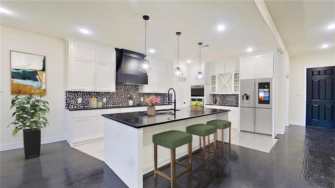 Kitchen with stainless steel appliances, white cabinets, backsplash, a breakfast bar area, and light wood finished floors Kitchen with stainless steel appliances, white cabinets, backsplash, a breakfast bar area, and light wood finished floors