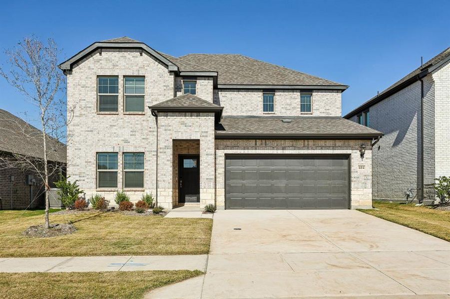 Front exterior of a new home in Southridge - Signature Series, McKinney, TX, highlighting curb appeal (Image 2). Front exterior of a new home in Southridge - Signature Series, McKinney, TX, highlighting curb appeal (Image 2).