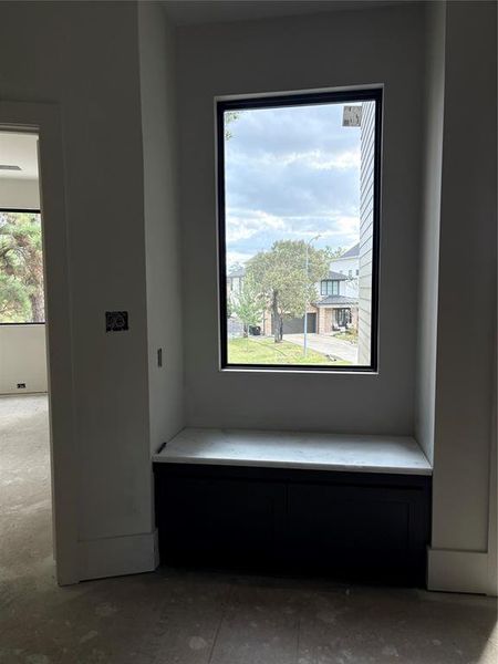 Sitting area at top of stairs .Bench has drawers for additional Storage.