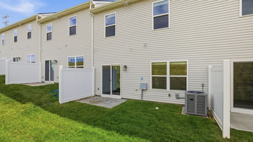 Exterior details and patio area of a home in Macon Townhomes, Seymour (Image 2). Exterior details and patio area of a home in Macon Townhomes, Seymour (Image 2).