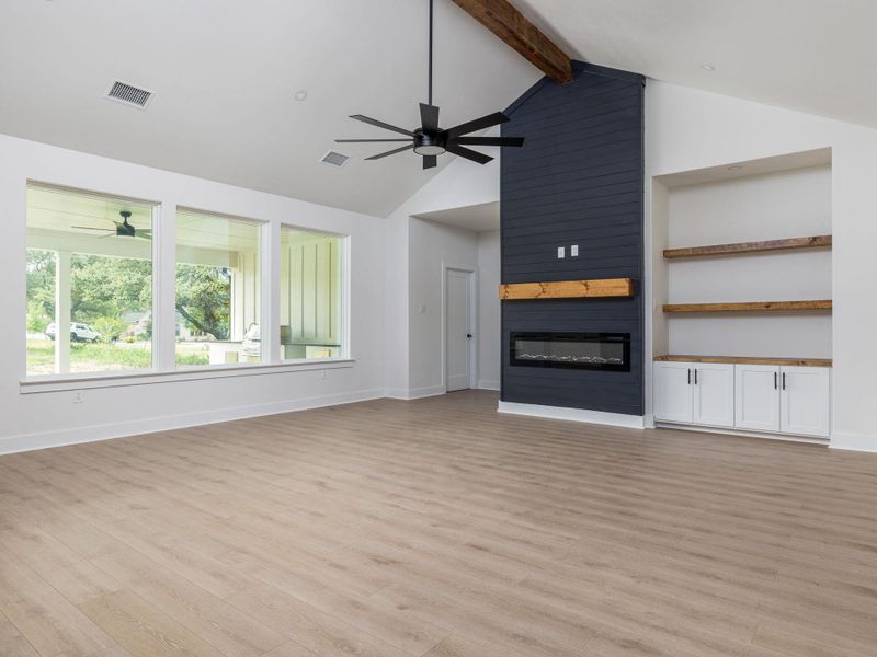 Family Room with natural lighting from huge windows overlooking back patio Family Room with natural lighting from huge windows overlooking back patio