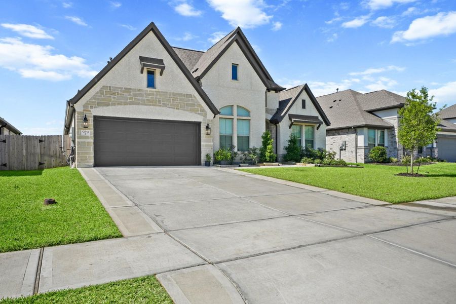 Front exterior of a new home in Westwood, League City, TX, highlighting curb appeal (Image 2). Front exterior of a new home in Westwood, League City, TX, highlighting curb appeal (Image 2).