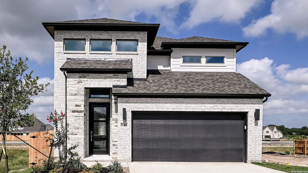 Front exterior of a new home in Legacy at Lake Dunlap, New Braunfels, TX, highlighting curb appeal (Image 23). Front exterior of a new home in Legacy at Lake Dunlap, New Braunfels, TX, highlighting curb appeal (Image 23).
