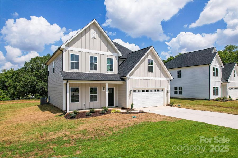Front exterior of a new home in , Harrisburg, NC, highlighting curb appeal (Image 19).