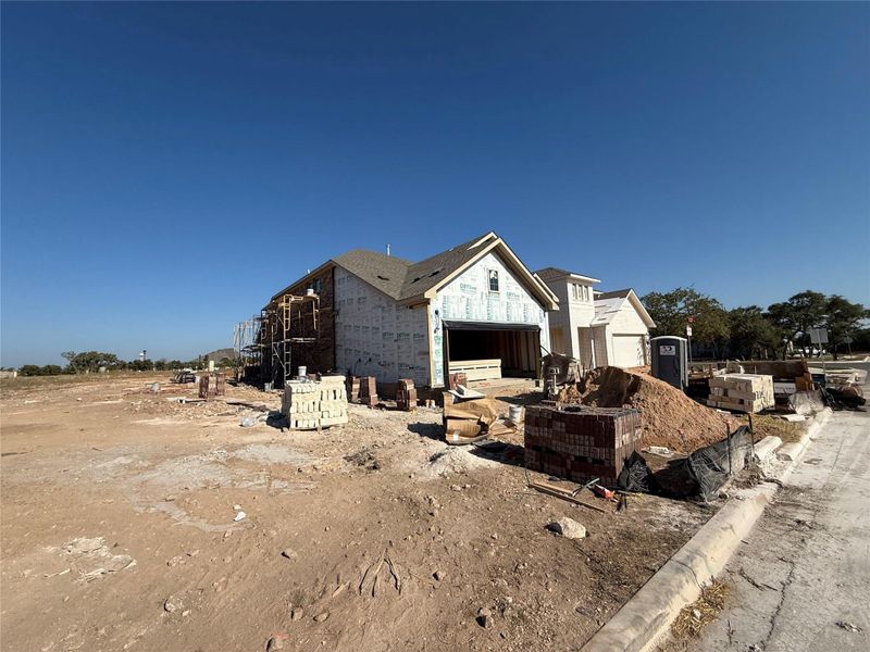In-progress construction of a new home in The Cottages at La Cima, San Marcos, TX (Image 22).