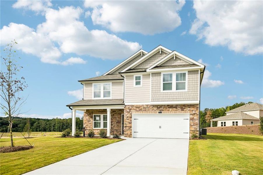 Front exterior of a new home in Northwoods at Mirror Lake, Villa Rica, GA, highlighting curb appeal (Image 25). Front exterior of a new home in Northwoods at Mirror Lake, Villa Rica, GA, highlighting curb appeal (Image 25).