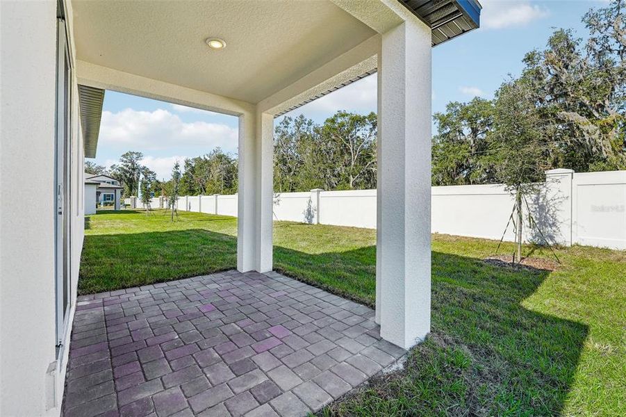 Exterior details and patio area of a home in Fox Pointe at Rivers Edge, Leesburg (Image 15).