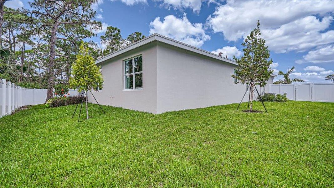 Exterior details and patio area of a home in Sandpiper Square, Stuart (Image 21).