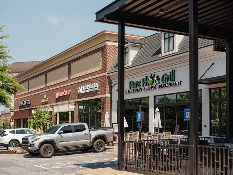 Front exterior of a new home in Palisades Townhomes, Cumming, GA, highlighting curb appeal (Image 32).