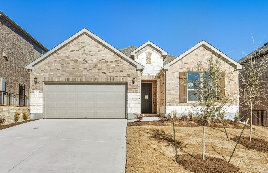 Front exterior of a new home in West Cypress Hills, Spicewood, TX, highlighting curb appeal (Image 24).