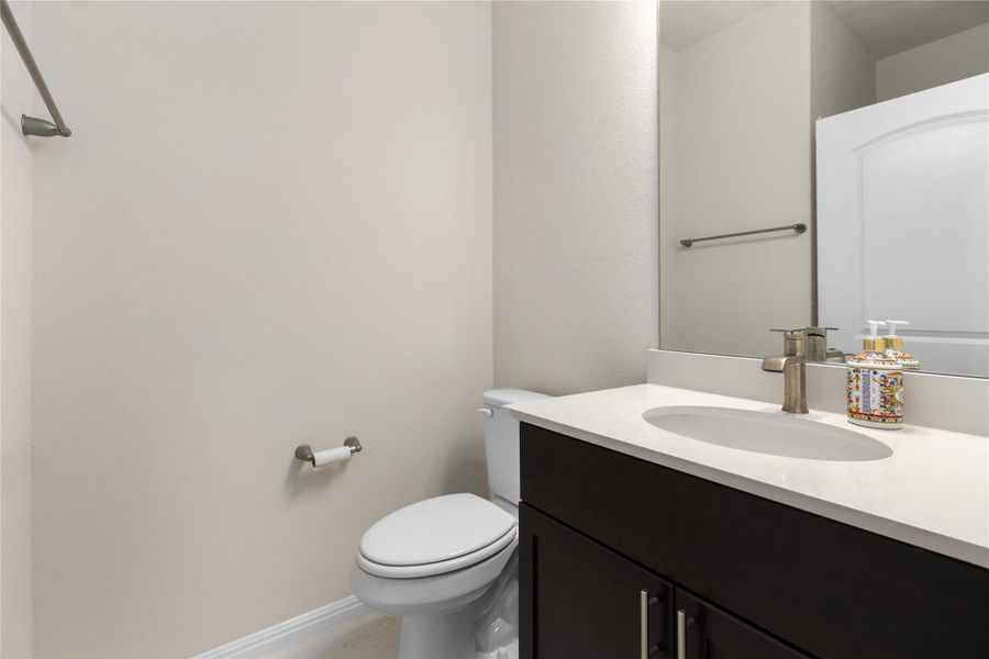 Bathroom featuring toilet and vanity