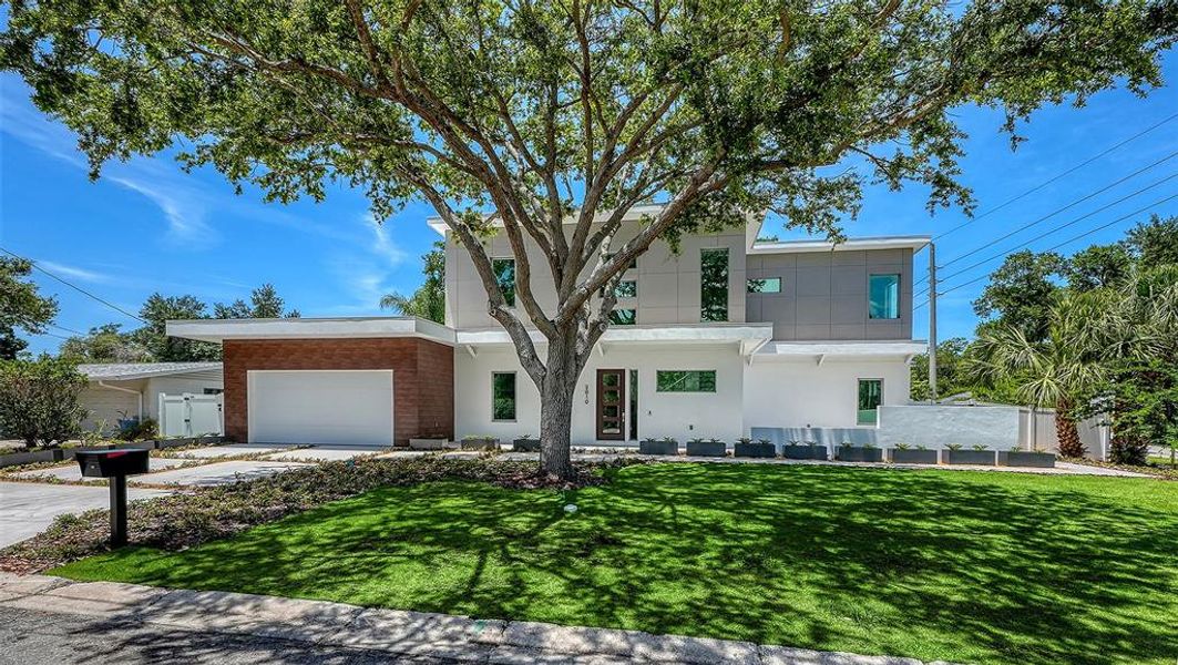 Front exterior of a new home in , Sarasota, FL, highlighting curb appeal (Image 24).
