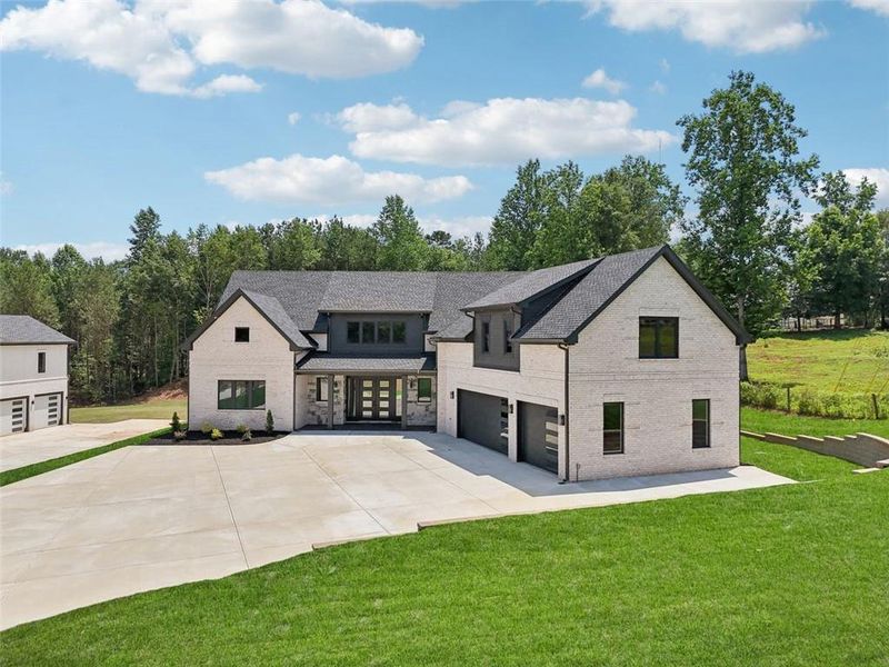 Front exterior of a new home in , Braselton, GA, highlighting curb appeal (Image 47). Front exterior of a new home in , Braselton, GA, highlighting curb appeal (Image 47).