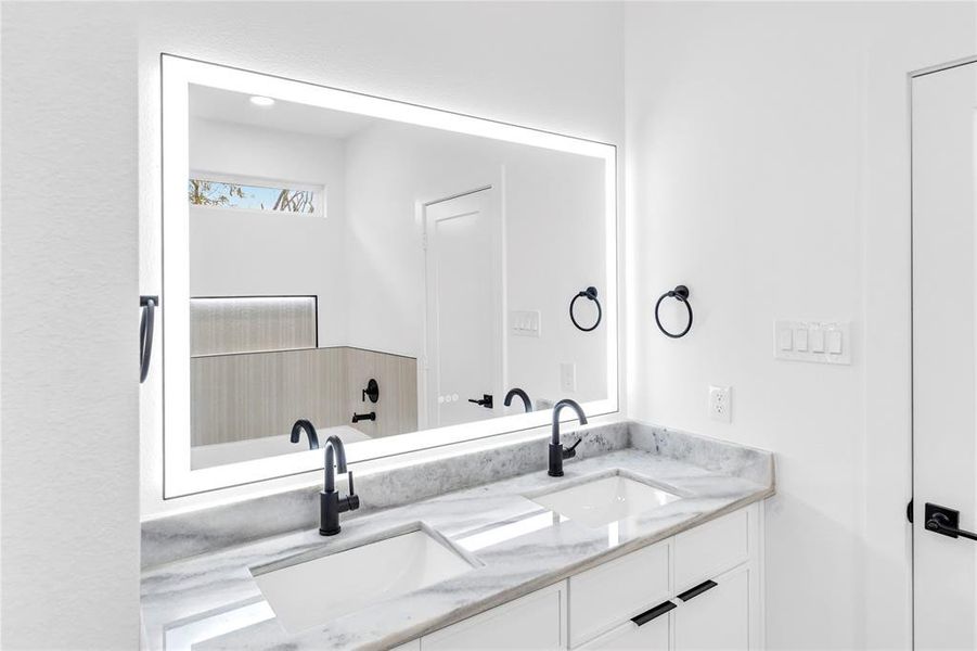 Bathroom featuring double vanity