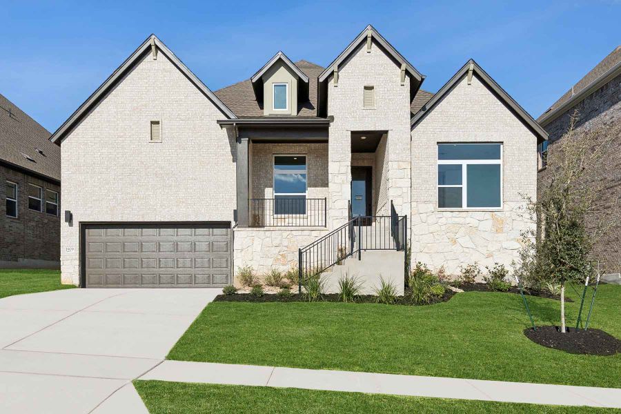 Representative exterior photo of a completed home built from the The Jacksboro by David Weekley Homes in Wolf Ranch – West Bend, Georgetown, TX (Image 1).