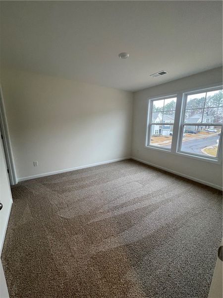 Spacious, unfurnished interior of a new home in Springwood Grove, Central (Image 31).