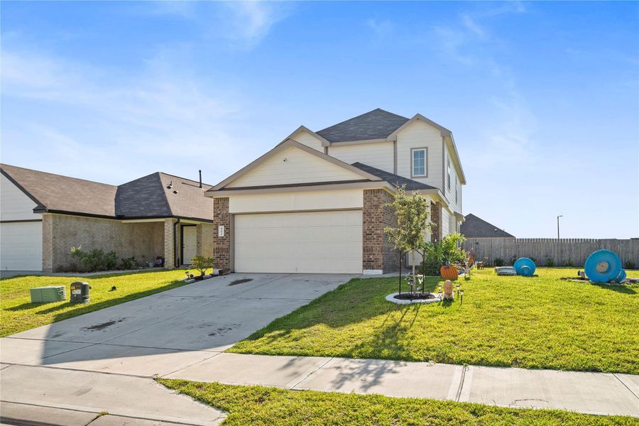 Front exterior of a new home in , Huntsville, TX, highlighting curb appeal (Image 2).