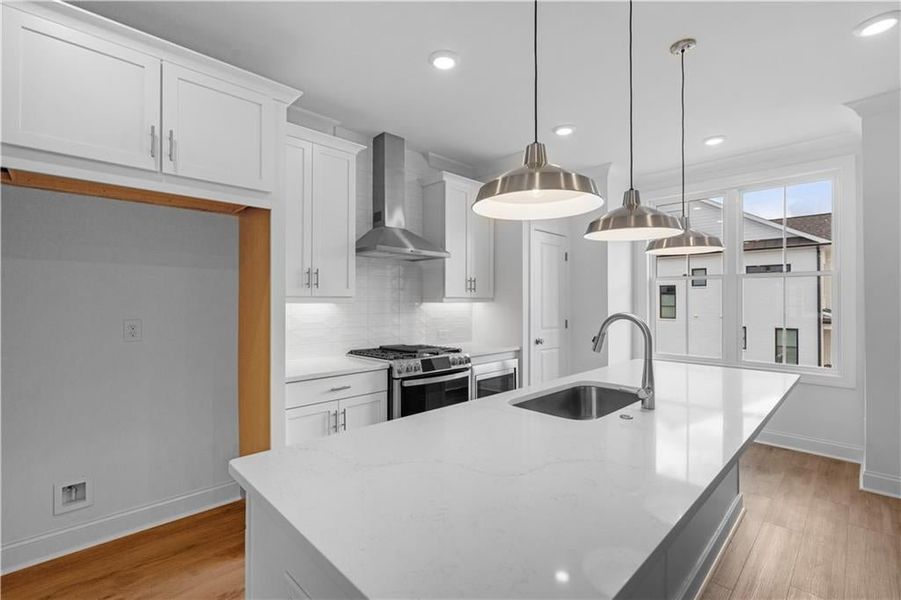 Quartz kitchen countertops with single bowl sink and 42 inch upper cabinets -*Pictures represent a previously built home, not the actual home, home is under construction*
