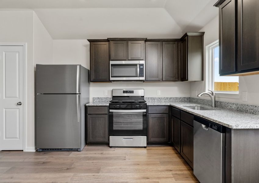 The kitchen has sprawling granite countertops. The kitchen has sprawling granite countertops.