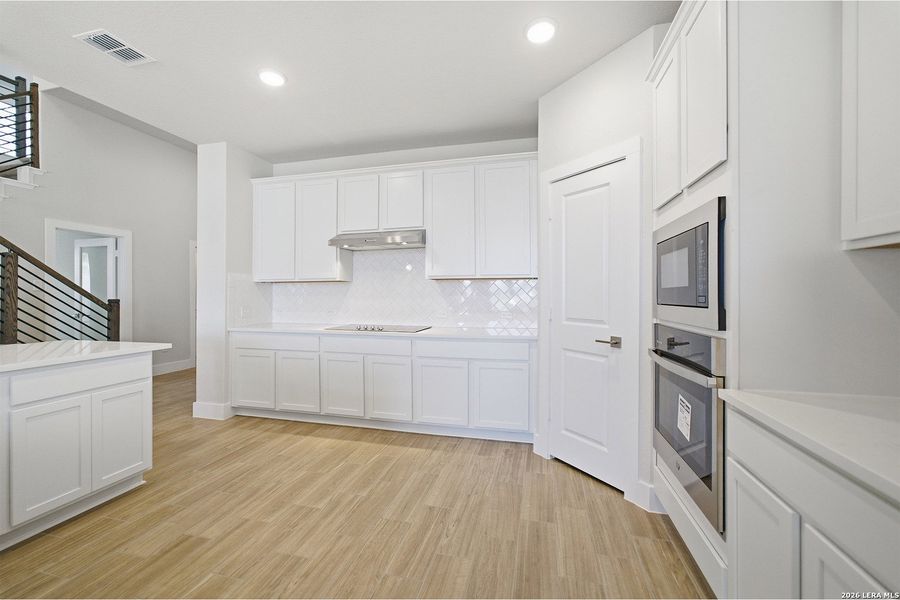 Furnished interior view inside a new home in The Woodlands at Medina Hills, Mico (Image 12).