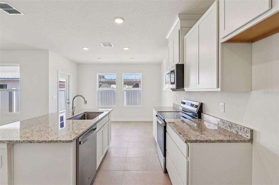 Furnished interior view inside a new home in Cyrene at Harmony, St. Cloud (Image 9).