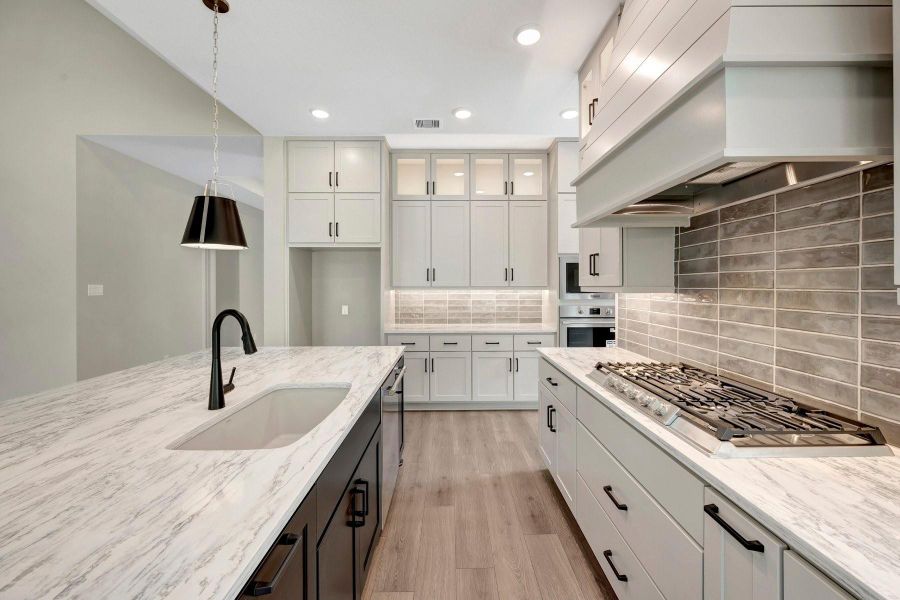 Another view of the pot/pan drawers, upgraded Blanco Kitchen sink, under cabinet lighting, pull out spice drawer, double trash drawer and so much more!