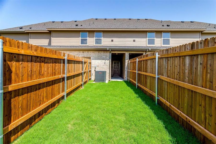 View of yard featuring central AC View of yard featuring central AC
