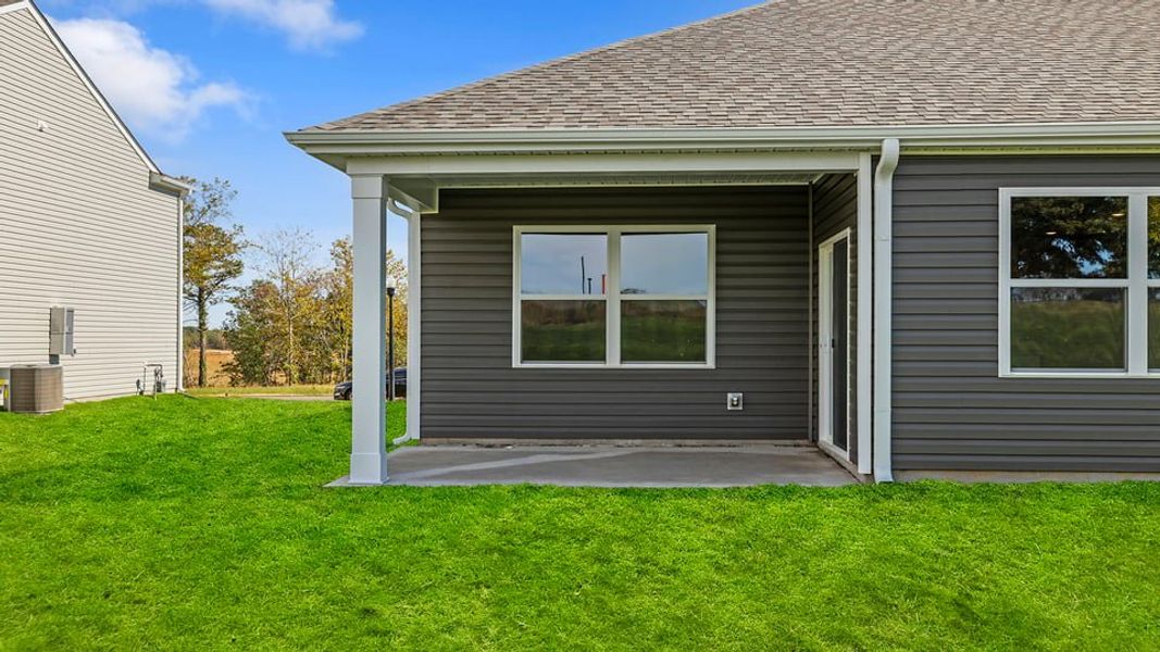 Exterior details and patio area of a home in Sherwood Gardens, Landrum (Image 18).