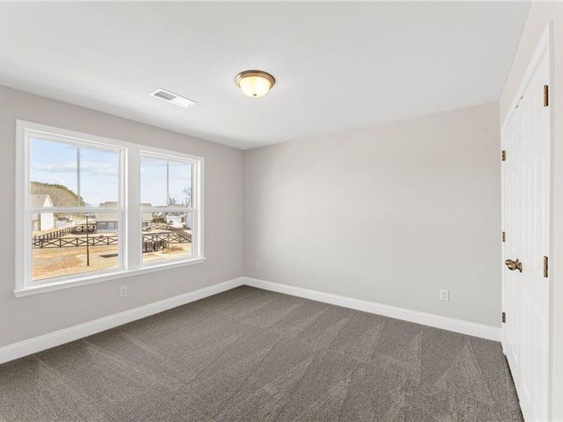 Spacious, unfurnished interior of a new home in Wehunt Meadows, Hoschton (Image 25).