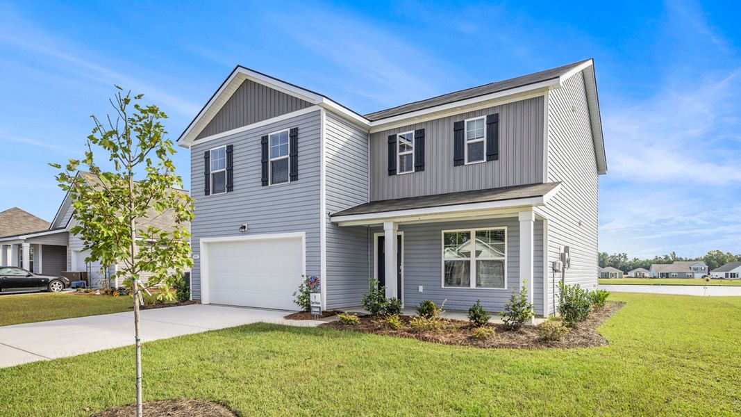 Front exterior of a new home in Dove Crossing, Conway, SC, highlighting curb appeal (Image 20). Front exterior of a new home in Dove Crossing, Conway, SC, highlighting curb appeal (Image 20).