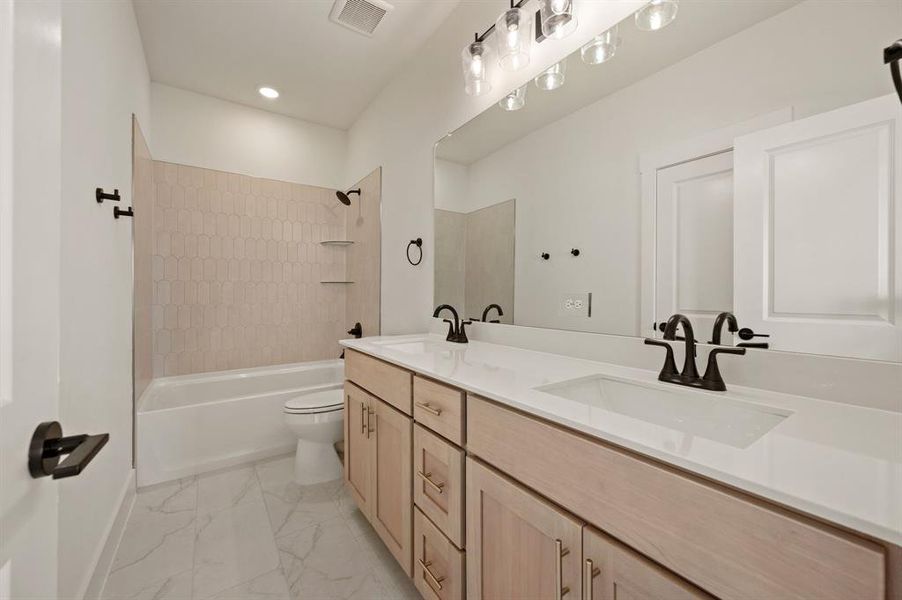 Friends and family will enjoy having their own vanity space in this lovely guest bath!
