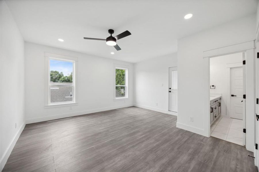 2nd floor bedroom with ceiling fan, and connected bathroom