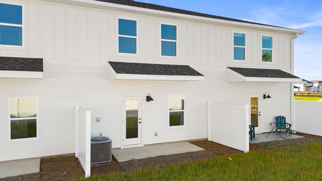 Exterior details and patio area of a home in Colonial East Townhomes, Panama City Beach (Image 2). Exterior details and patio area of a home in Colonial East Townhomes, Panama City Beach (Image 2).