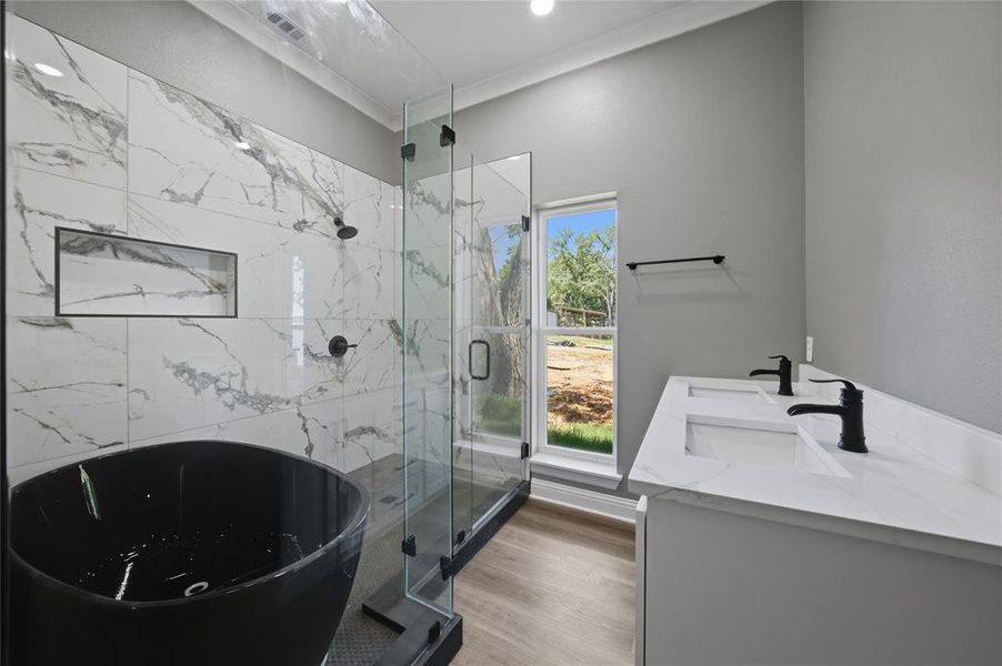 Walk in closet with built ins off of this primary bath.
