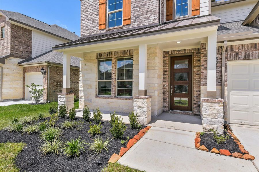 Front exterior of a new home in Stone Creek Ranch, Hockley, TX, highlighting curb appeal (Image 21). Front exterior of a new home in Stone Creek Ranch, Hockley, TX, highlighting curb appeal (Image 21).