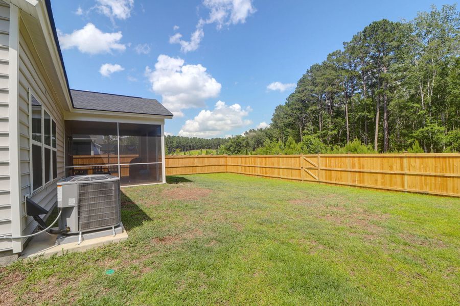 Exterior details and patio area of a home in Sweetgrass at Summers Corner: Arbor Collection, Summerville (Image 27).