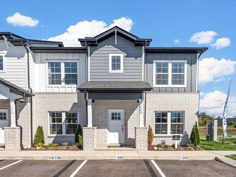 Front exterior of a new home in The Towns at Red River, Gallatin, TN, highlighting curb appeal (Image 2). Front exterior of a new home in The Towns at Red River, Gallatin, TN, highlighting curb appeal (Image 2).