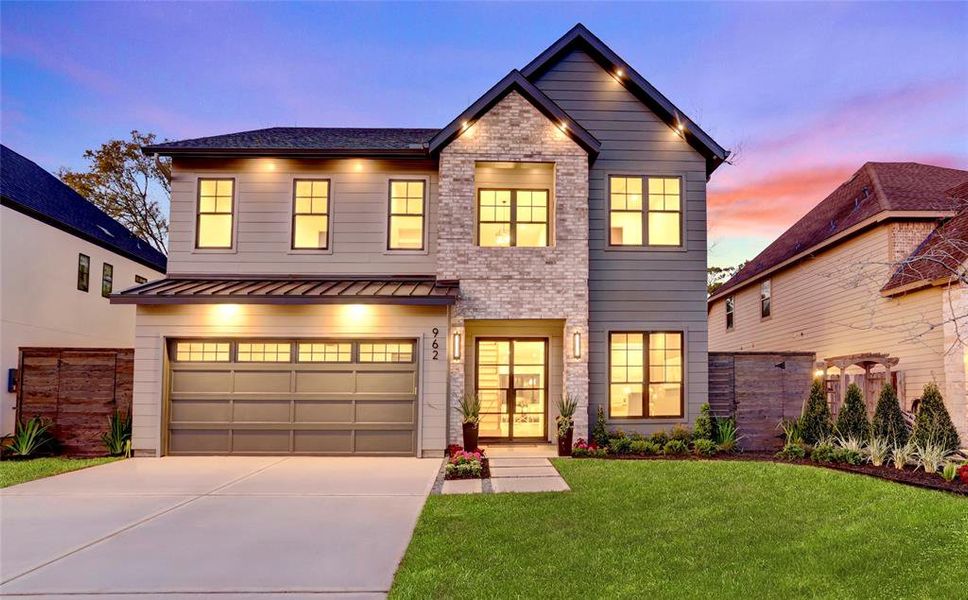 FRONT ELEVATION: The elegant curb appeal beautifully transitions modern & traditional architecture. Artisan siding by hardi-plank, and brick two-story entry tower.  Stained cedar fencing with gates on both sides, and note the generous setbacks throughout Garden Oaks of 10+ feet on each side.